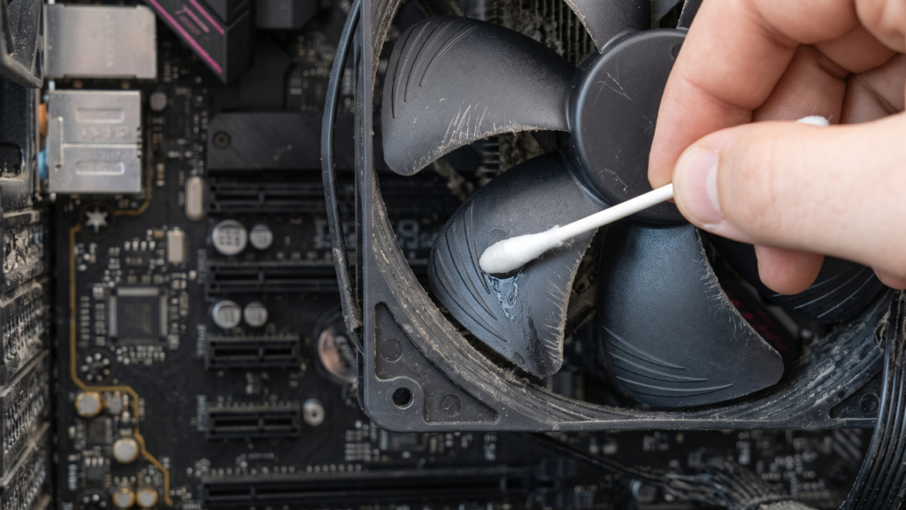 For sticky, caked-on dust that air can't shift, a cotton swab moistened with 99% Isopropyl Alcohol is the professional solution.